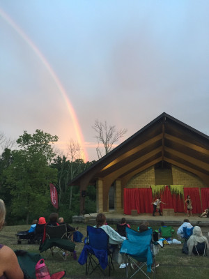 A rainbow appears during a free Shakespeare in the Park production from Cincinnati Shakespeare Company. (Photo credit: John David Back)